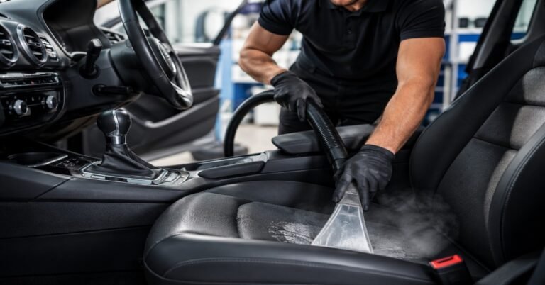 Professional car interior deep clean Buffalo NY — WNY Car Wash technician performing a 10-step detailing process on a vehicle cabin.